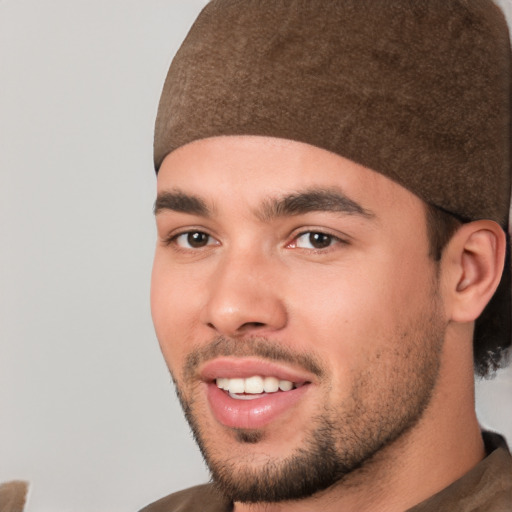 Joyful white young-adult male with short  black hair and brown eyes