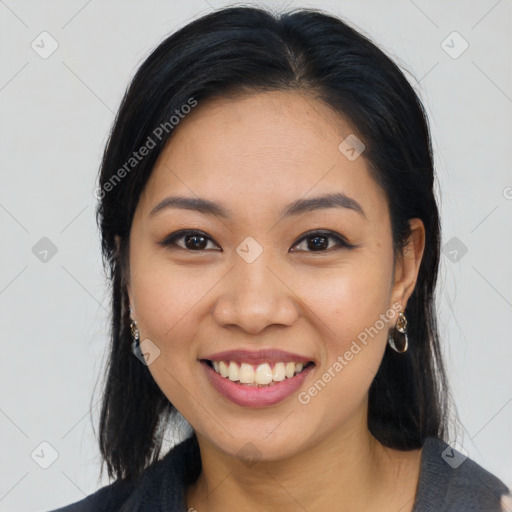 Joyful asian young-adult female with long  brown hair and brown eyes