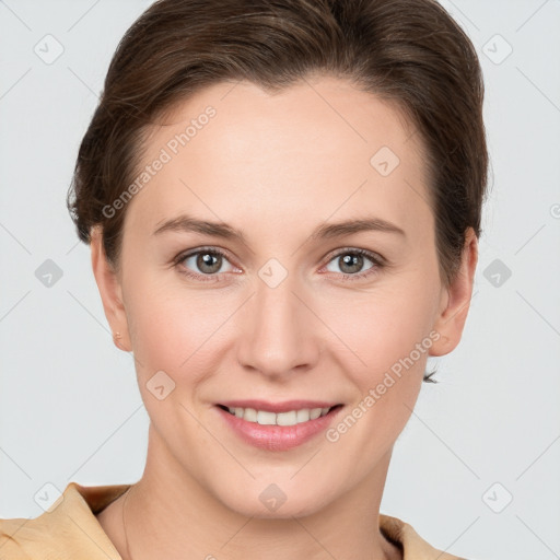 Joyful white young-adult female with short  brown hair and grey eyes