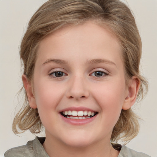 Joyful white child female with medium  brown hair and grey eyes