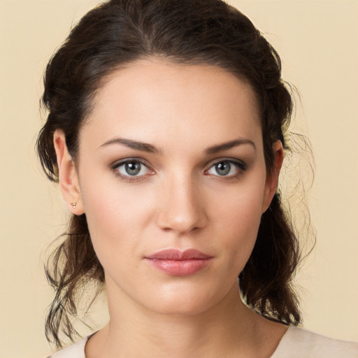 Neutral white young-adult female with medium  brown hair and brown eyes