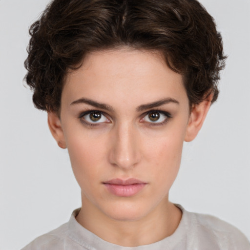 Neutral white young-adult female with short  brown hair and brown eyes