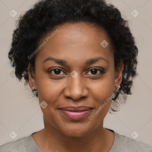 Joyful black adult female with short  brown hair and brown eyes