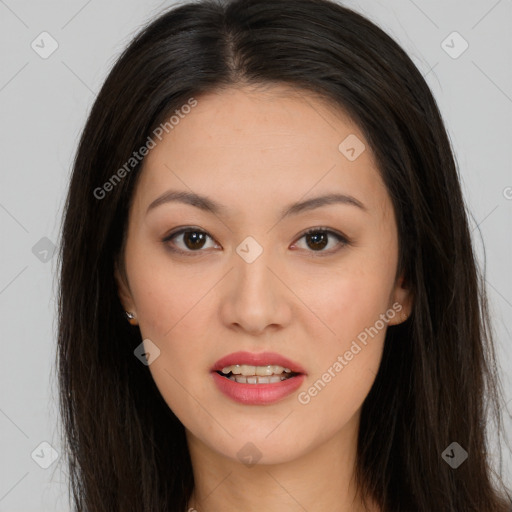 Joyful asian young-adult female with long  brown hair and brown eyes