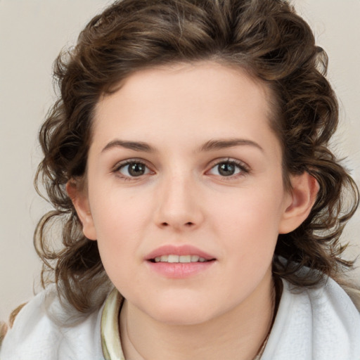 Joyful white child female with medium  brown hair and brown eyes