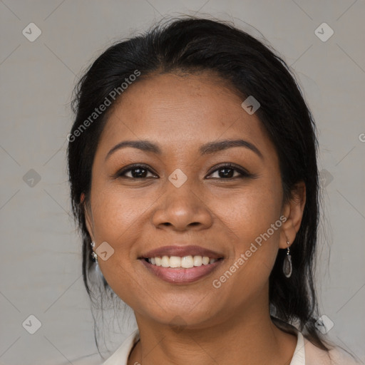 Joyful latino young-adult female with medium  brown hair and brown eyes