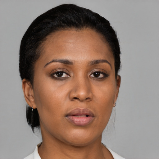 Joyful asian young-adult female with short  black hair and brown eyes