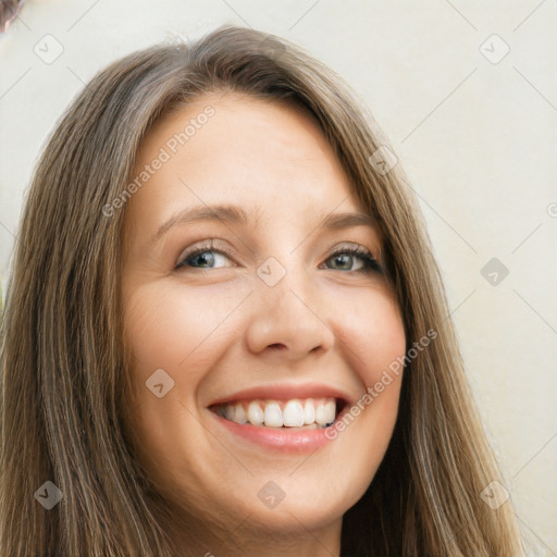 Joyful white young-adult female with long  brown hair and green eyes