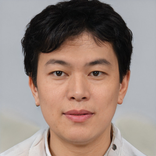 Neutral asian young-adult male with short  brown hair and brown eyes