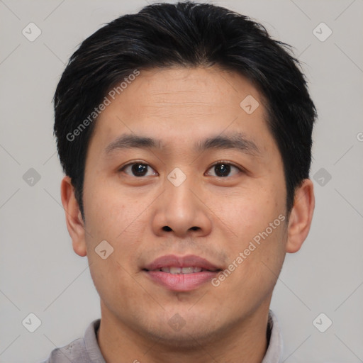 Joyful asian young-adult male with short  brown hair and brown eyes