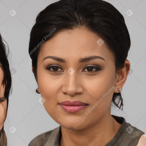 Joyful latino young-adult female with medium  brown hair and brown eyes