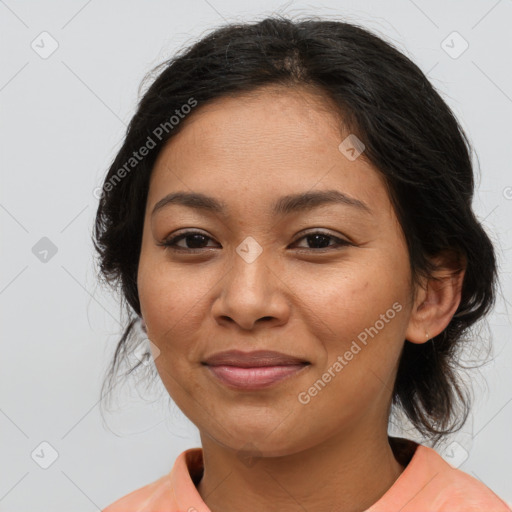 Joyful latino young-adult female with medium  brown hair and brown eyes