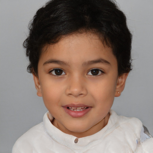 Joyful latino child female with short  brown hair and brown eyes