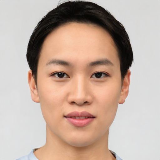 Joyful asian young-adult female with short  black hair and brown eyes
