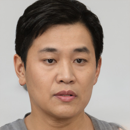 Neutral asian young-adult male with short  black hair and brown eyes