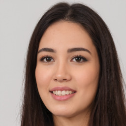 Joyful white young-adult female with long  brown hair and brown eyes