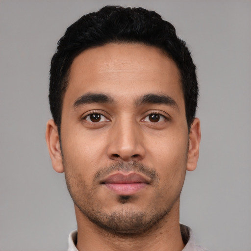 Neutral latino young-adult male with short  black hair and brown eyes