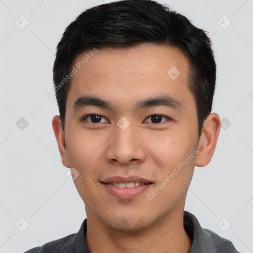 Joyful white young-adult male with short  black hair and brown eyes