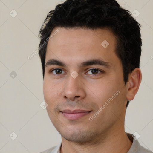 Joyful white young-adult male with short  black hair and brown eyes