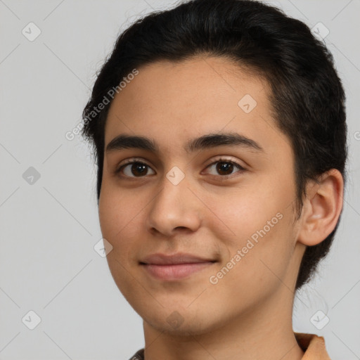 Joyful latino young-adult male with short  brown hair and brown eyes