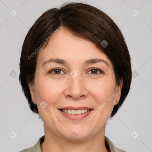 Joyful white adult female with medium  brown hair and brown eyes