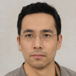 Neutral asian young-adult male with short  black hair and brown eyes