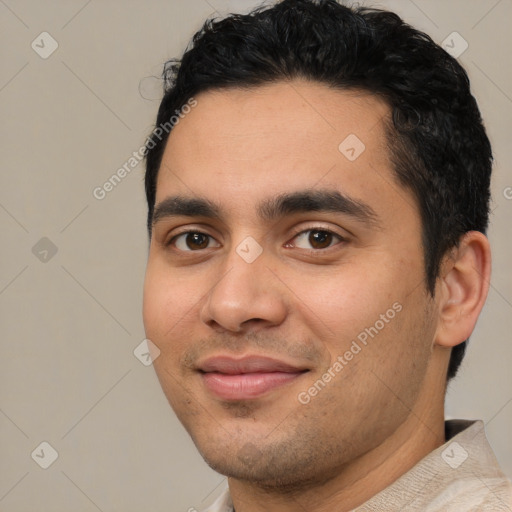 Joyful white young-adult male with short  black hair and brown eyes