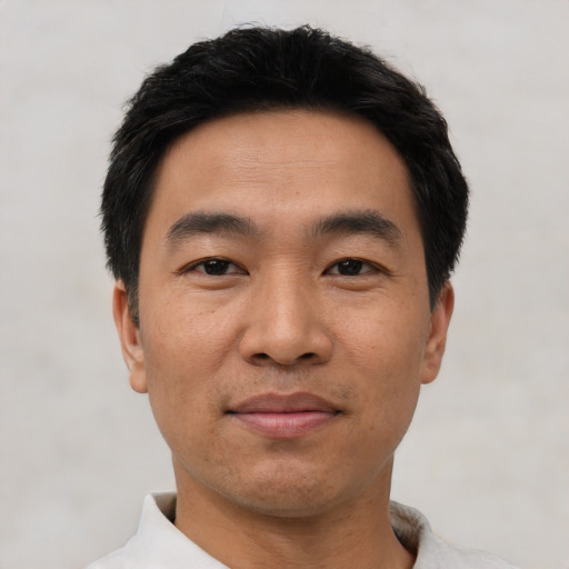 Neutral asian adult male with short  black hair and brown eyes