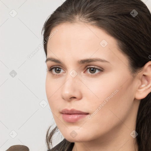 Neutral white young-adult female with medium  brown hair and brown eyes