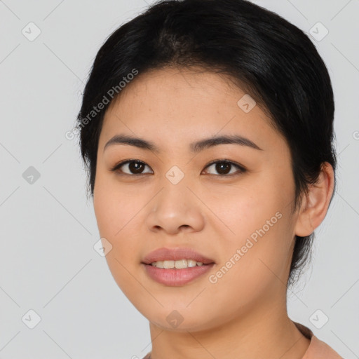 Joyful asian young-adult female with short  black hair and brown eyes