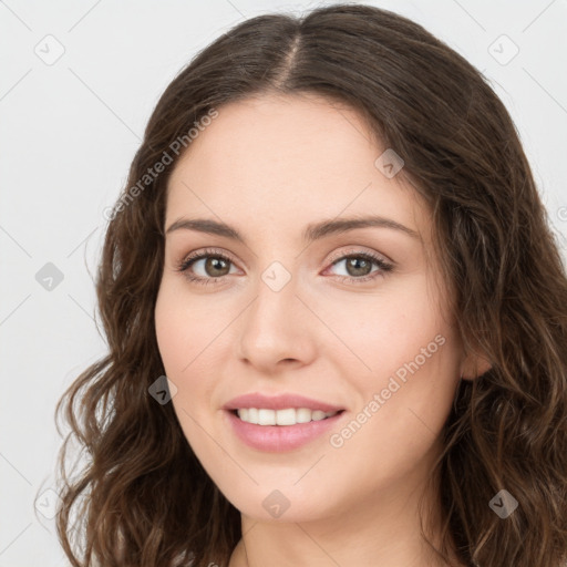 Joyful white young-adult female with long  brown hair and green eyes