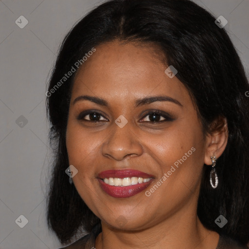 Joyful black young-adult female with long  brown hair and brown eyes