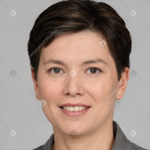 Joyful white adult female with short  brown hair and grey eyes