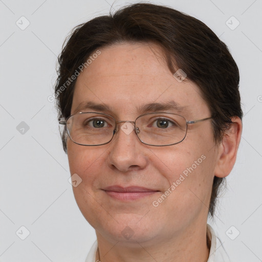 Joyful white adult female with short  brown hair and brown eyes