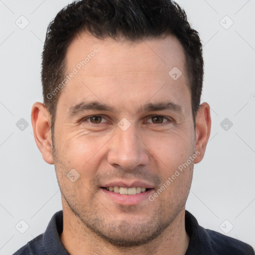 Joyful white adult male with short  brown hair and brown eyes