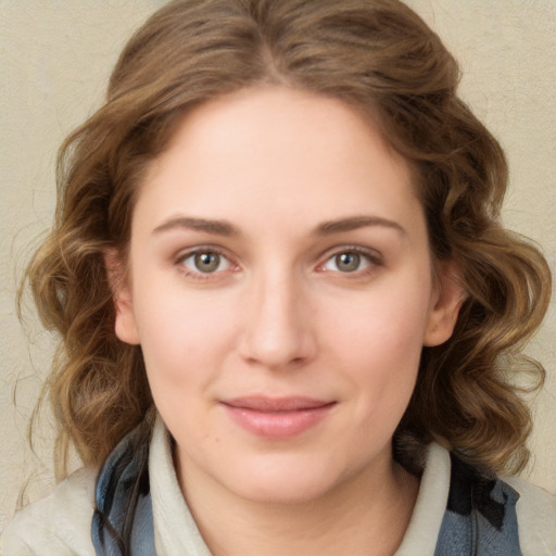 Joyful white young-adult female with medium  brown hair and green eyes