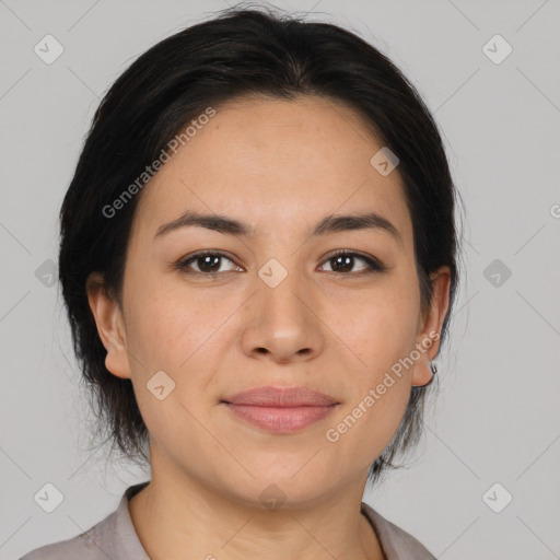 Joyful latino young-adult female with medium  brown hair and brown eyes