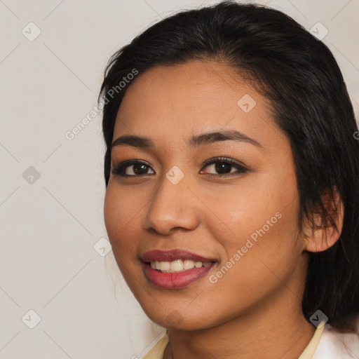 Joyful asian young-adult female with medium  brown hair and brown eyes