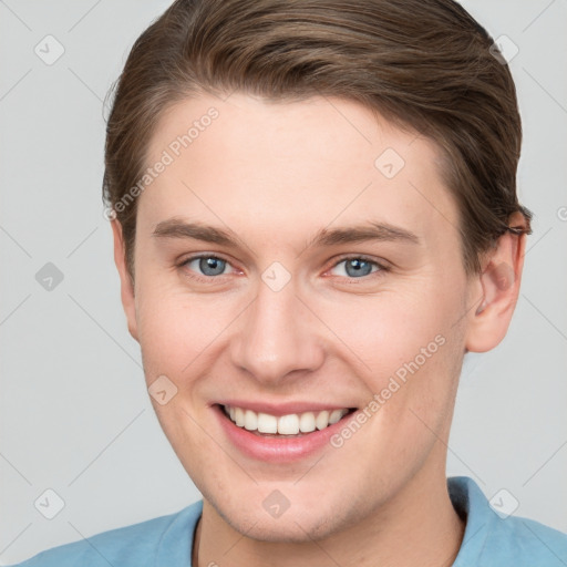 Joyful white young-adult female with short  brown hair and grey eyes