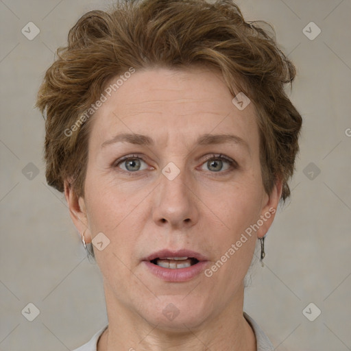 Joyful white adult female with short  brown hair and grey eyes