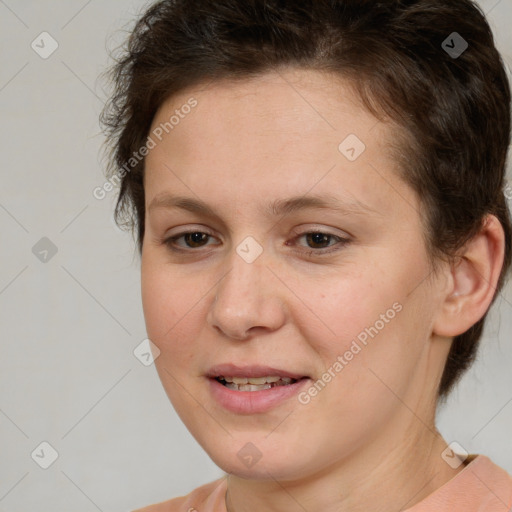 Joyful white adult female with short  brown hair and brown eyes