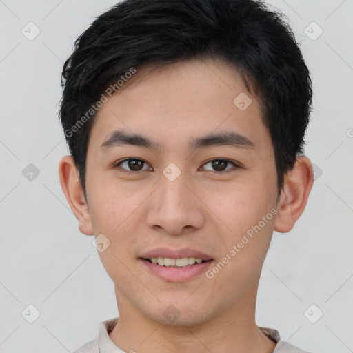 Joyful asian young-adult male with short  brown hair and brown eyes