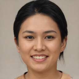 Joyful asian young-adult female with medium  brown hair and brown eyes