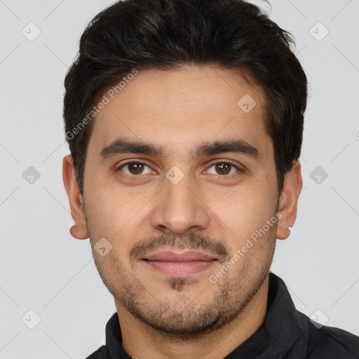 Joyful white young-adult male with short  black hair and brown eyes