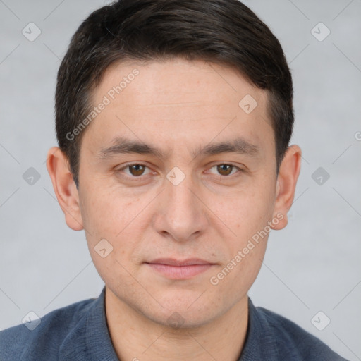 Joyful white adult male with short  brown hair and brown eyes