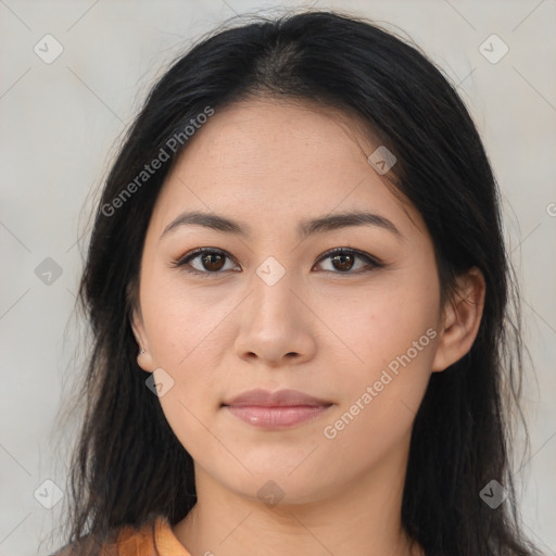 Joyful asian young-adult female with long  brown hair and brown eyes