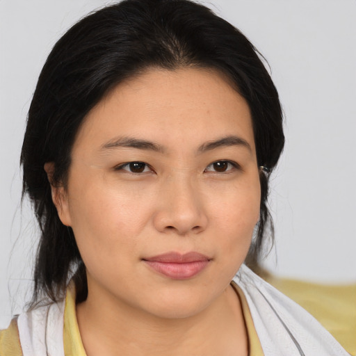 Neutral asian young-adult female with medium  brown hair and brown eyes