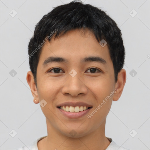 Joyful asian young-adult male with short  black hair and brown eyes