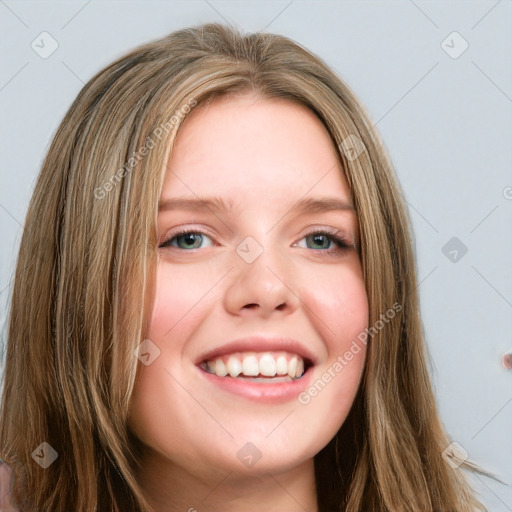 Joyful white young-adult female with long  brown hair and green eyes