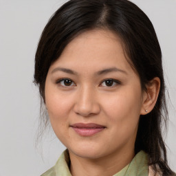 Joyful white young-adult female with medium  brown hair and brown eyes